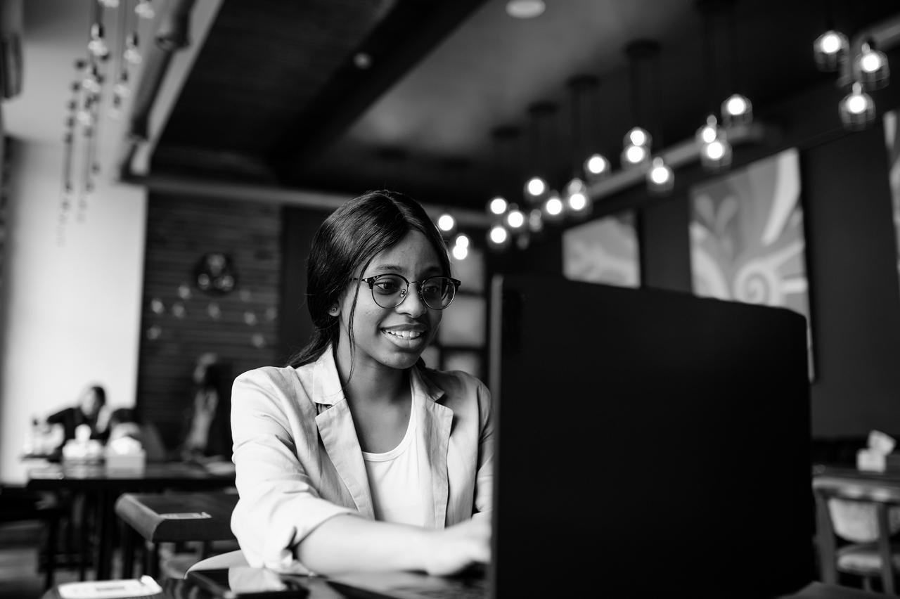 Happy woman using a laptop computer