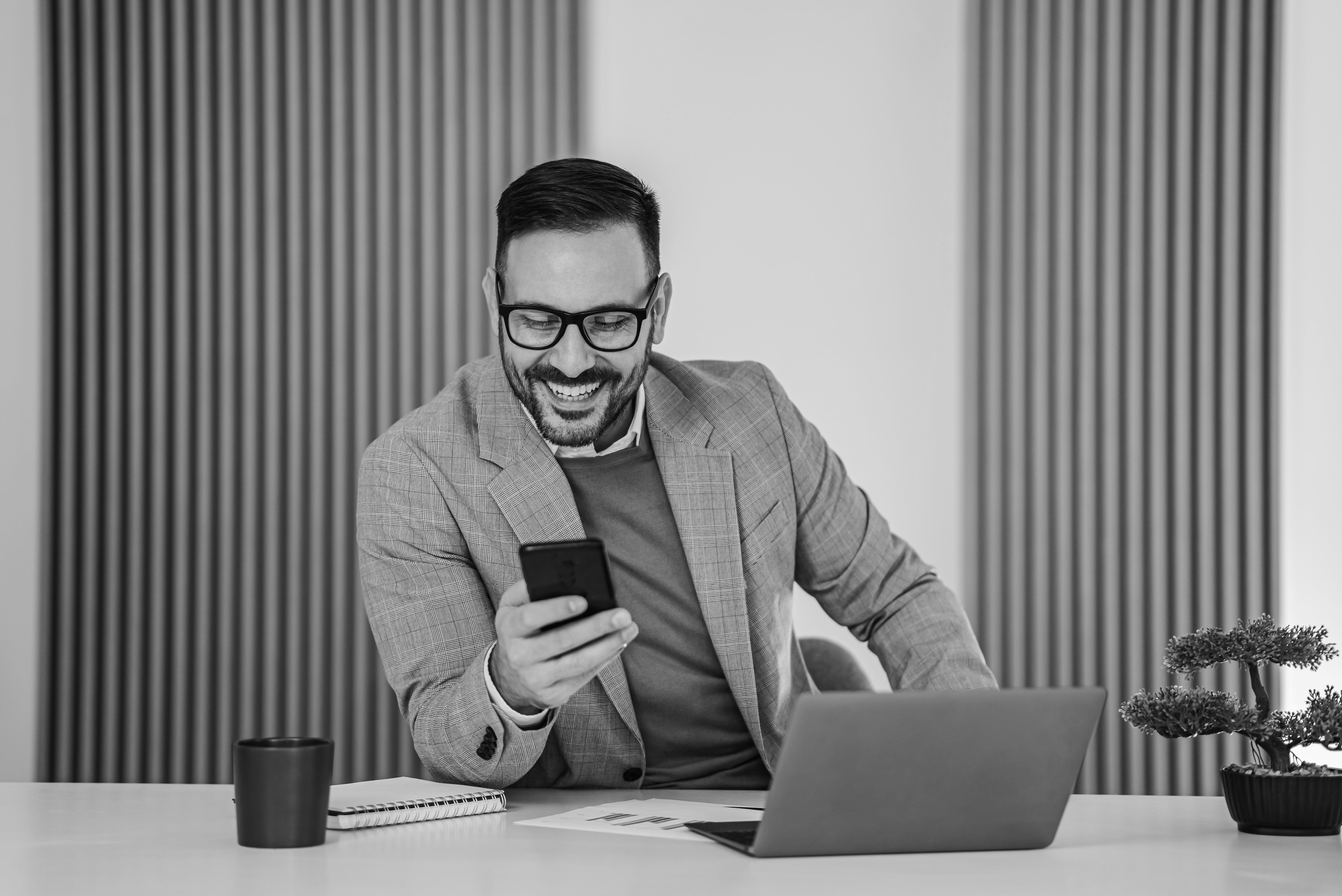 man smiling looking at phone.jpg